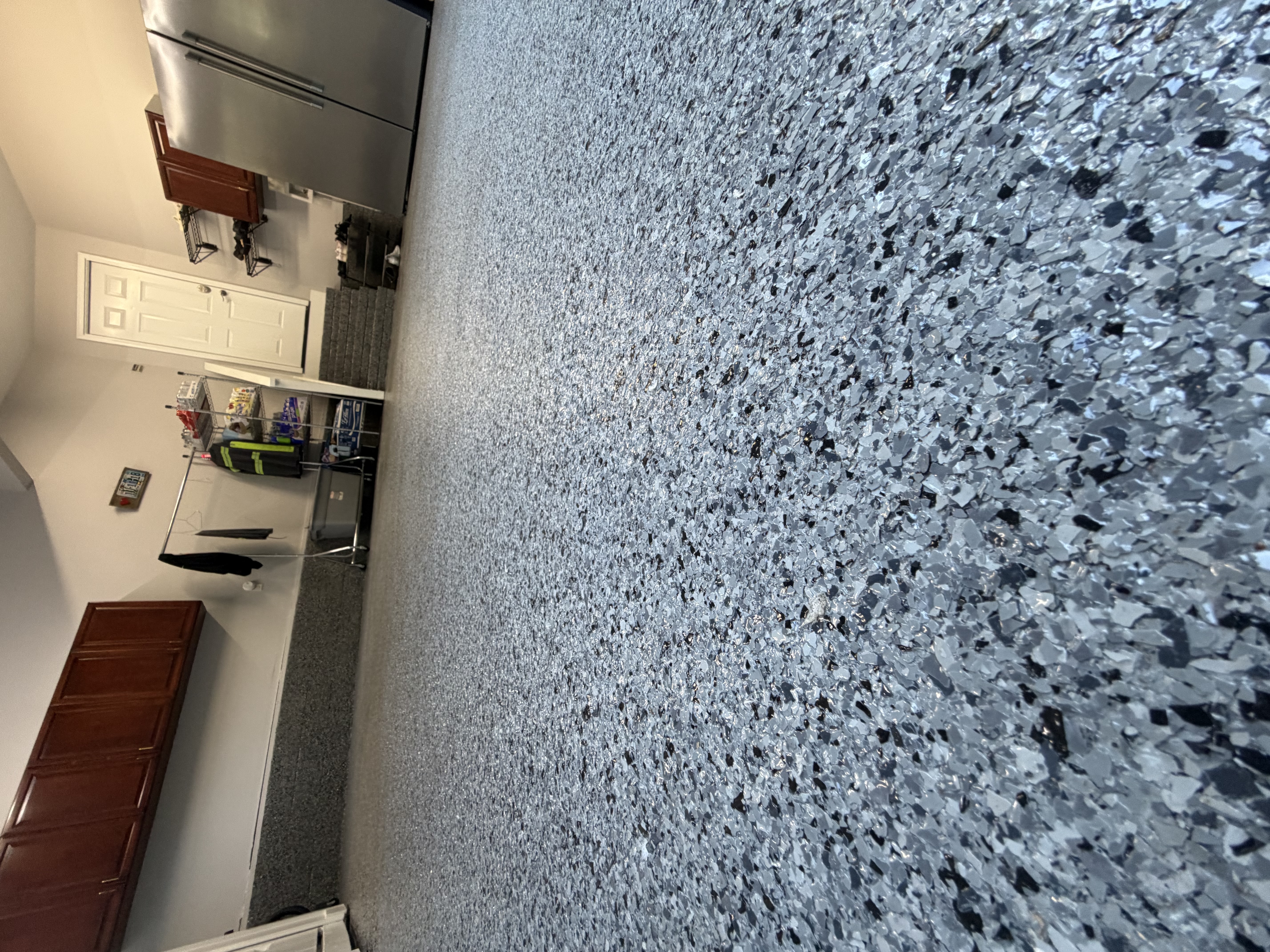 Durable coated garage floor finished by Vital Flooring